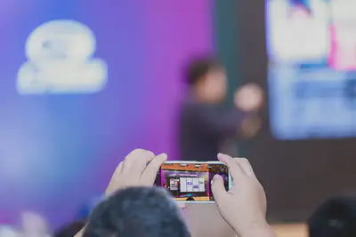 A view of the scholarship event through an attendee's phone