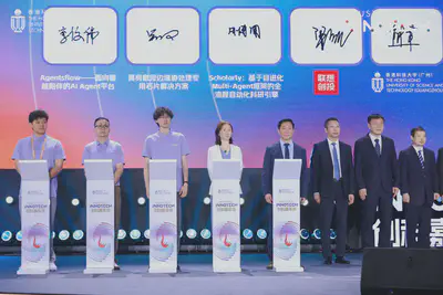 Group photo on stage after the signing ceremony